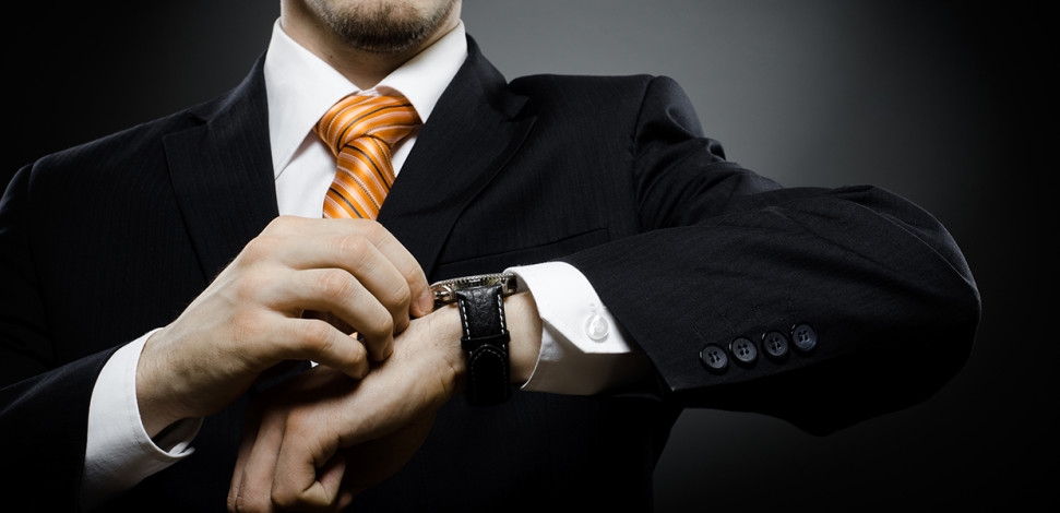 Time to Unlock Telecom’s Next Innovation Wave blog hero - Man in suit checking watch